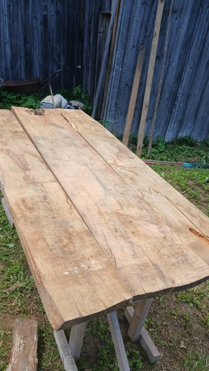 Cleaned oak boards arranged as a possible tabletop layout.
