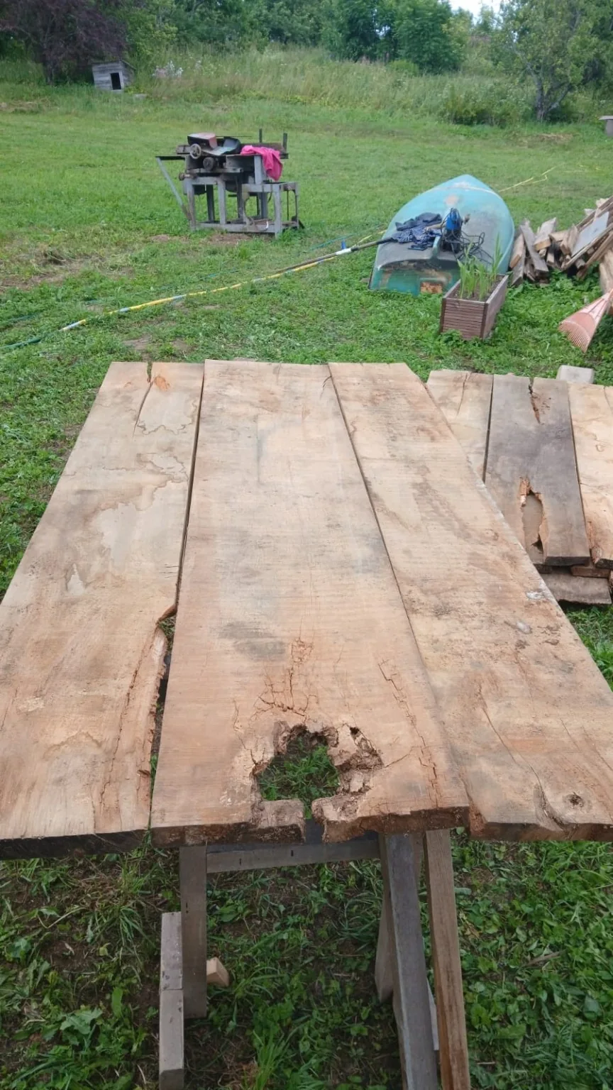 Rustic oak boards with holes and natural defects; good for before/after or material honesty.
